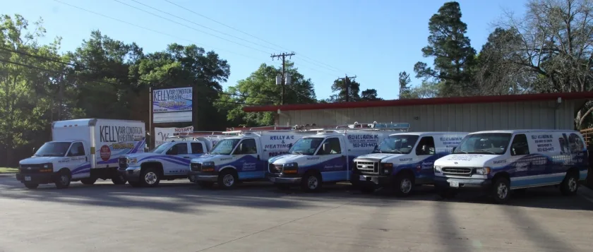 Kelly A/C and Heating service trucks lined up outside the Whitehouse office