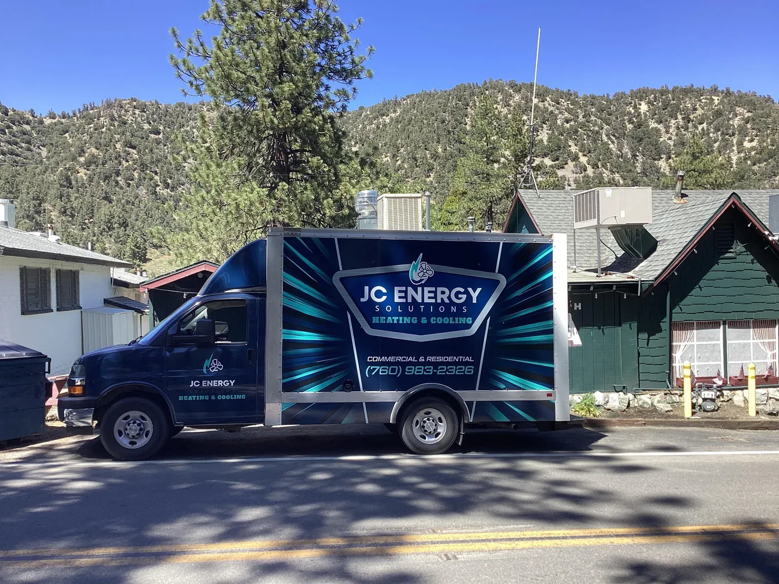 JC Energy Solutions box truck parked on a street in the High Desert