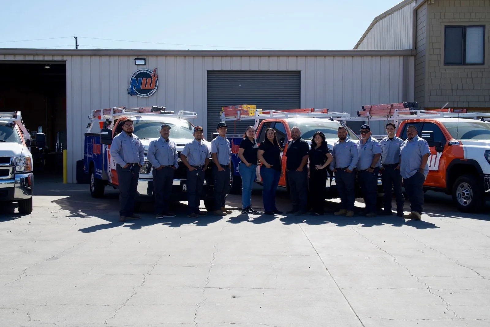Northwind Heating and Air team in front of its trucks at the Tulare shop
