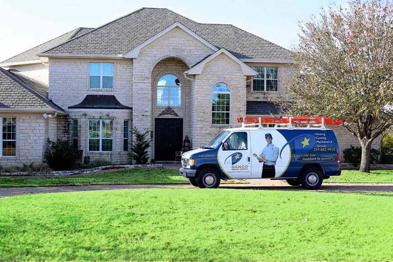 Danco service van parked outside a home